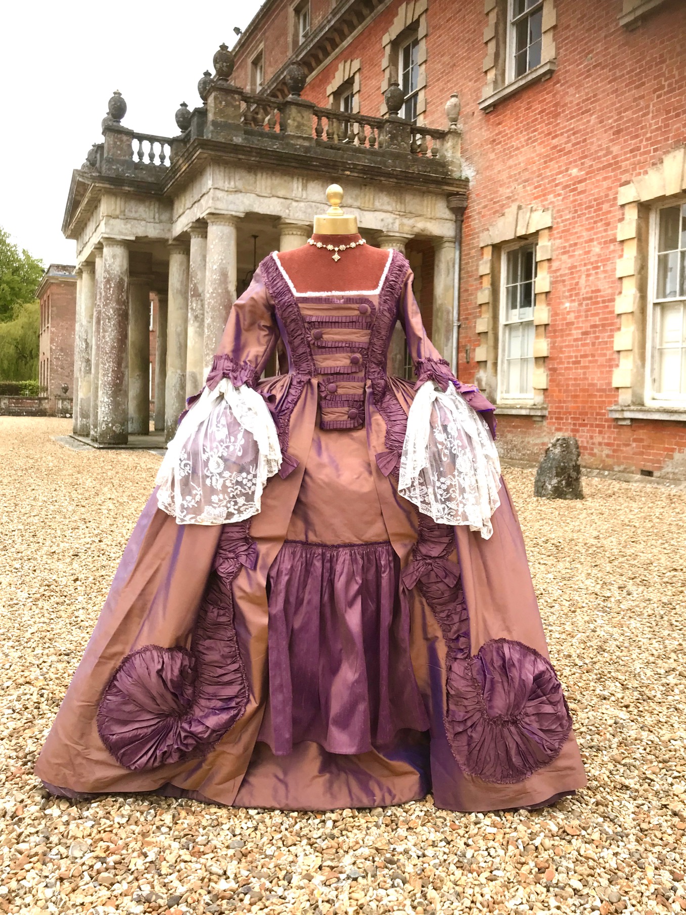 An exceptional lady's 18th century style sack dress, bronze and purple with fine lace cuffs - with skirt and pannier frame. Ex London Festival Opera 'The Magic Flute'.